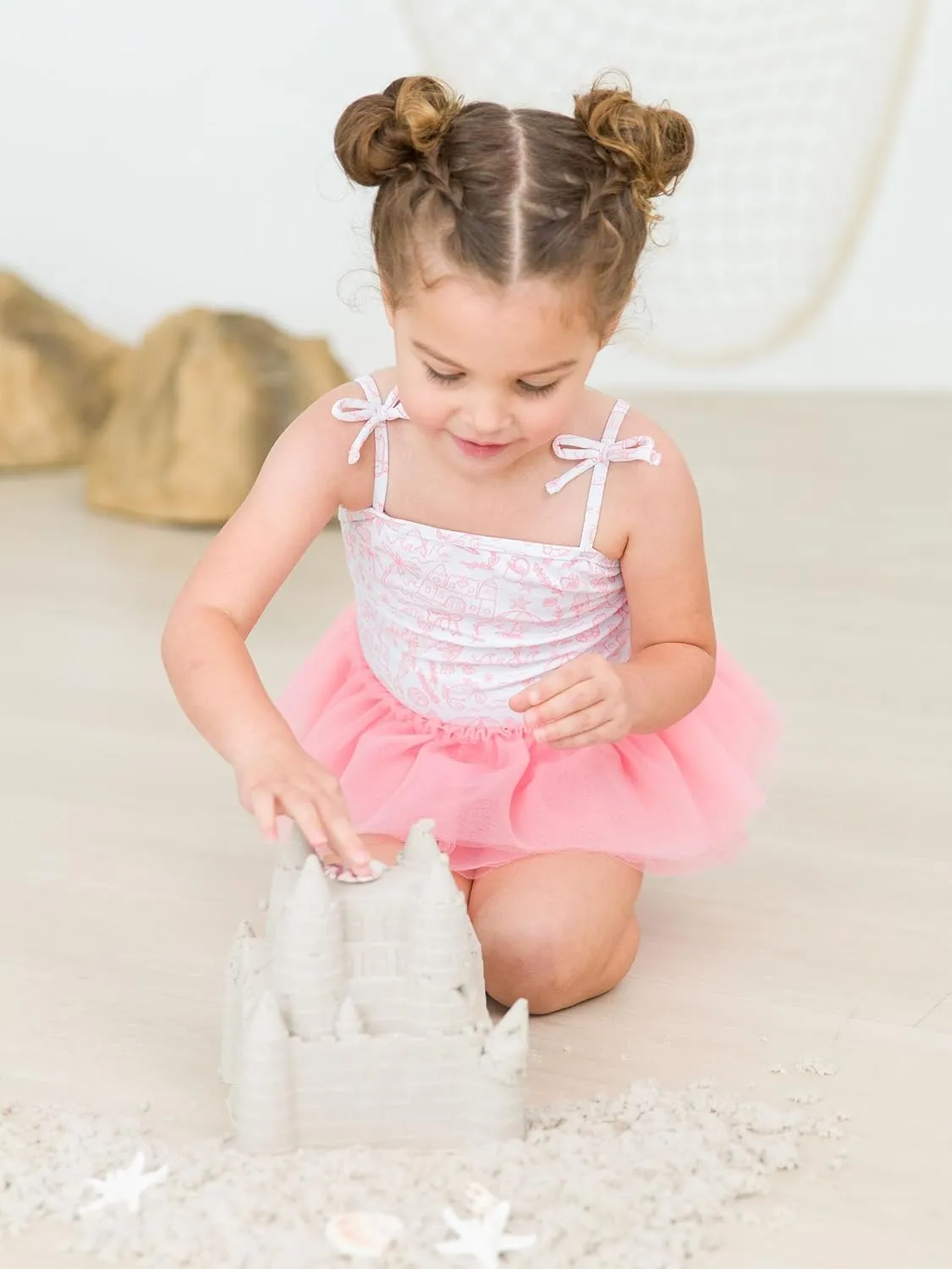 RuffleButts Girls UPF50  Sun Protection Peplum Smocked Bodice/Tulle Skirted One Piece Swimsuit