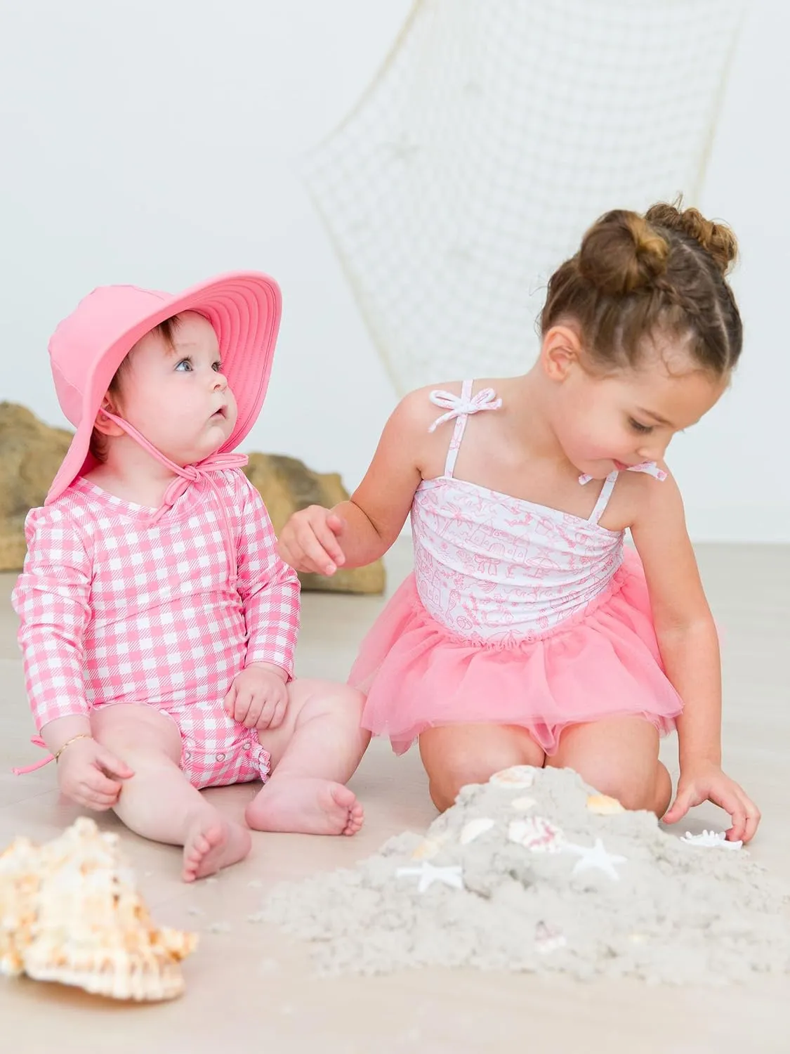 RuffleButts Girls UPF50  Sun Protection Peplum Smocked Bodice/Tulle Skirted One Piece Swimsuit